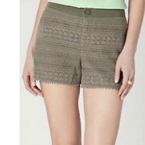Anthropologie Daughters of the Liberation green shorts with crochet overlay